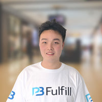 Person wearing a white shirt with a logo in an indoor setting