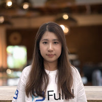 Young woman with long hair sitting in a cafe