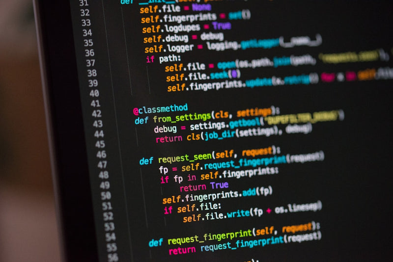 Close-up of a computer screen displaying code with colorful syntax highlighting.