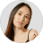 Woman with a neutral expression on a plain background