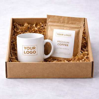 Gift set with a white mug and coffee package in a brown box on a light gray background