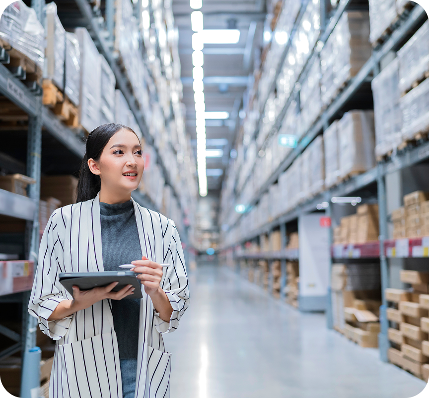 Warehouse staff checking inventory with tablet in a fulfillment center